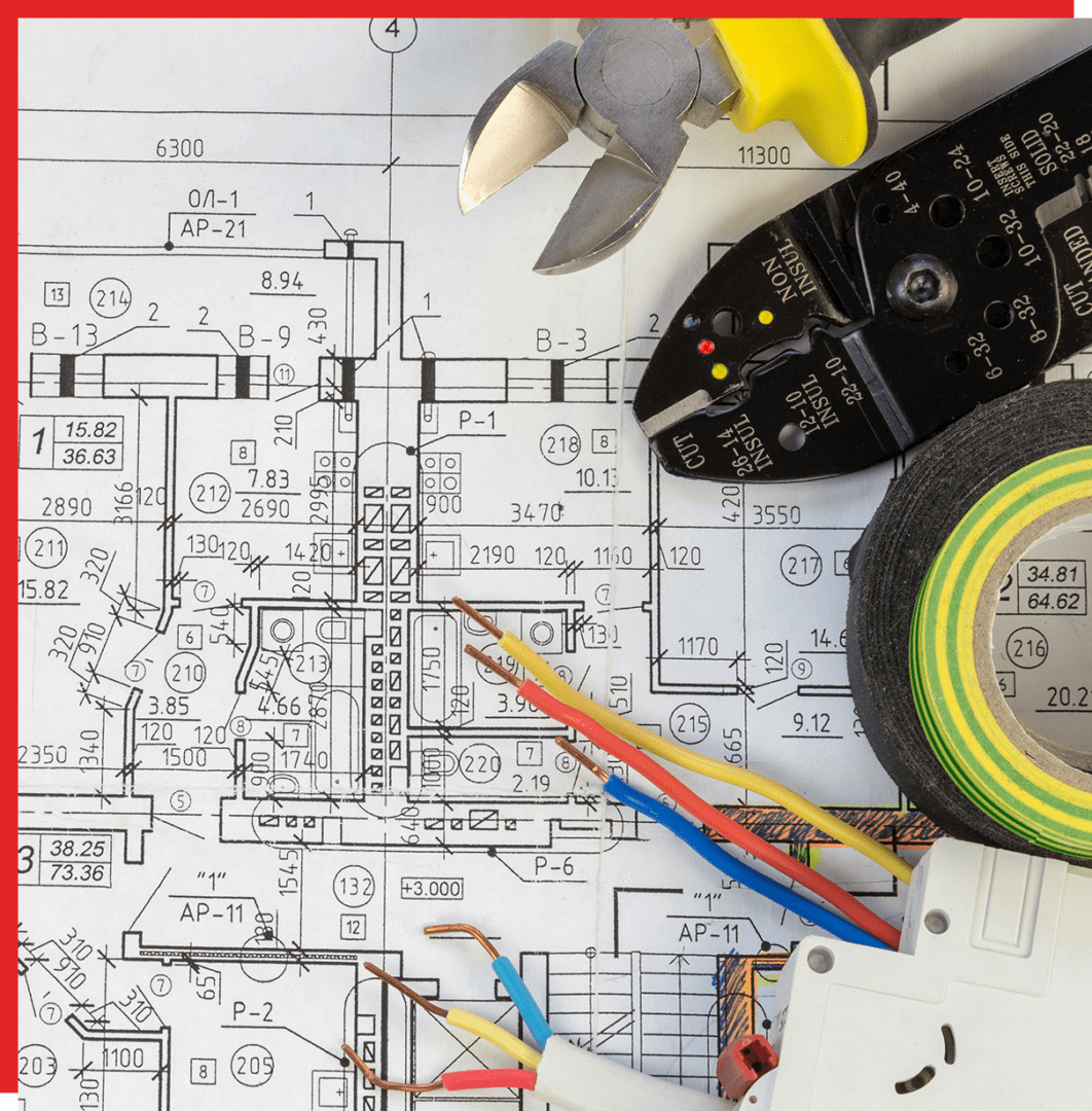 An electrical blueprint with wire cutters, electrical tape, and colored wires laid on top.