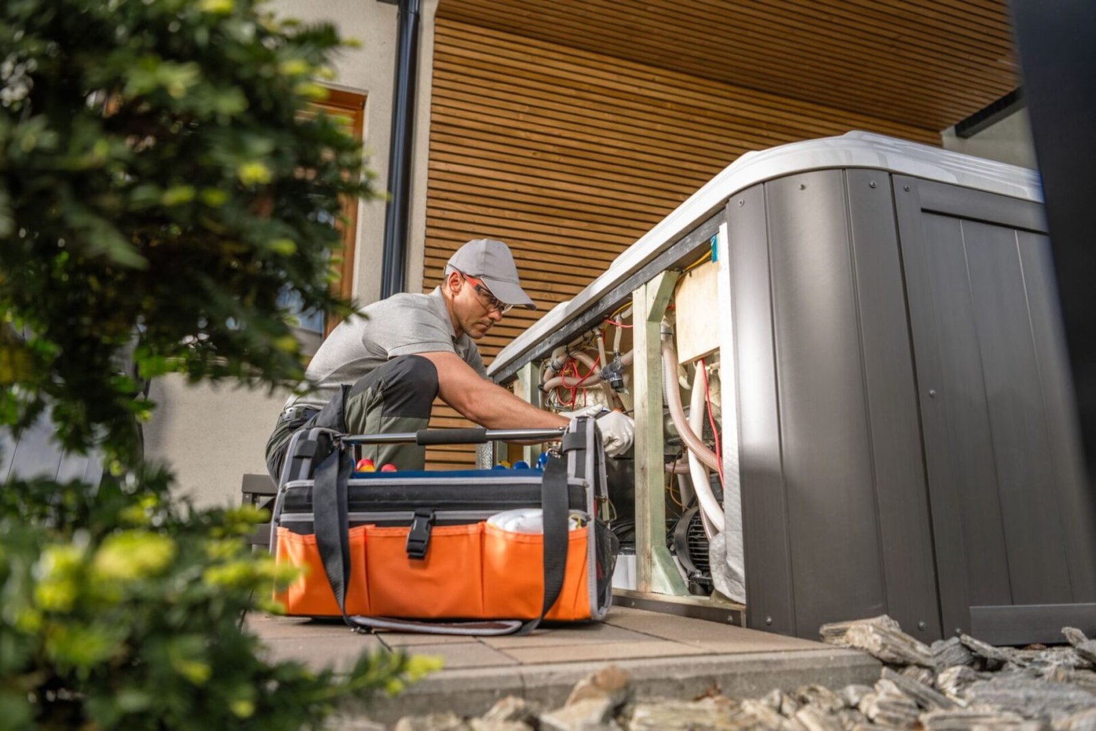 A man loading luggage into an elevator.